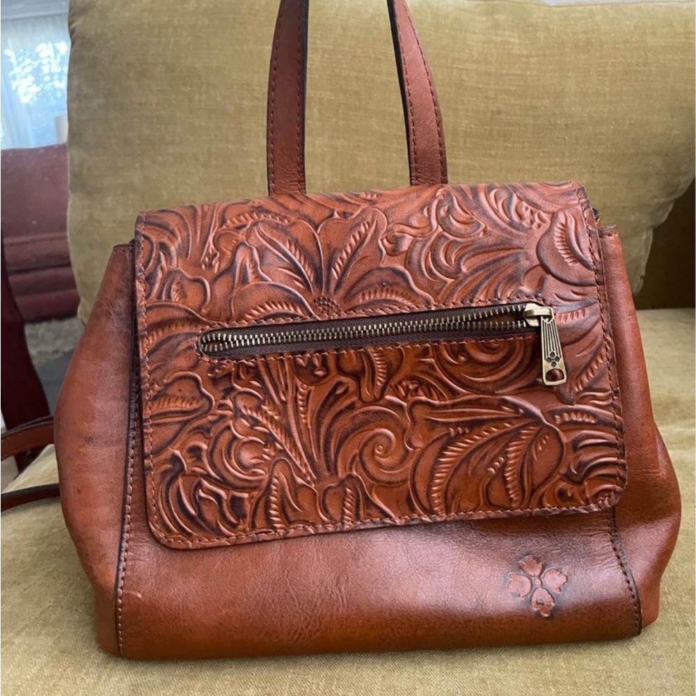 Leather book bag/purse. Floral tooling detail. Plenty of space. Rarely used